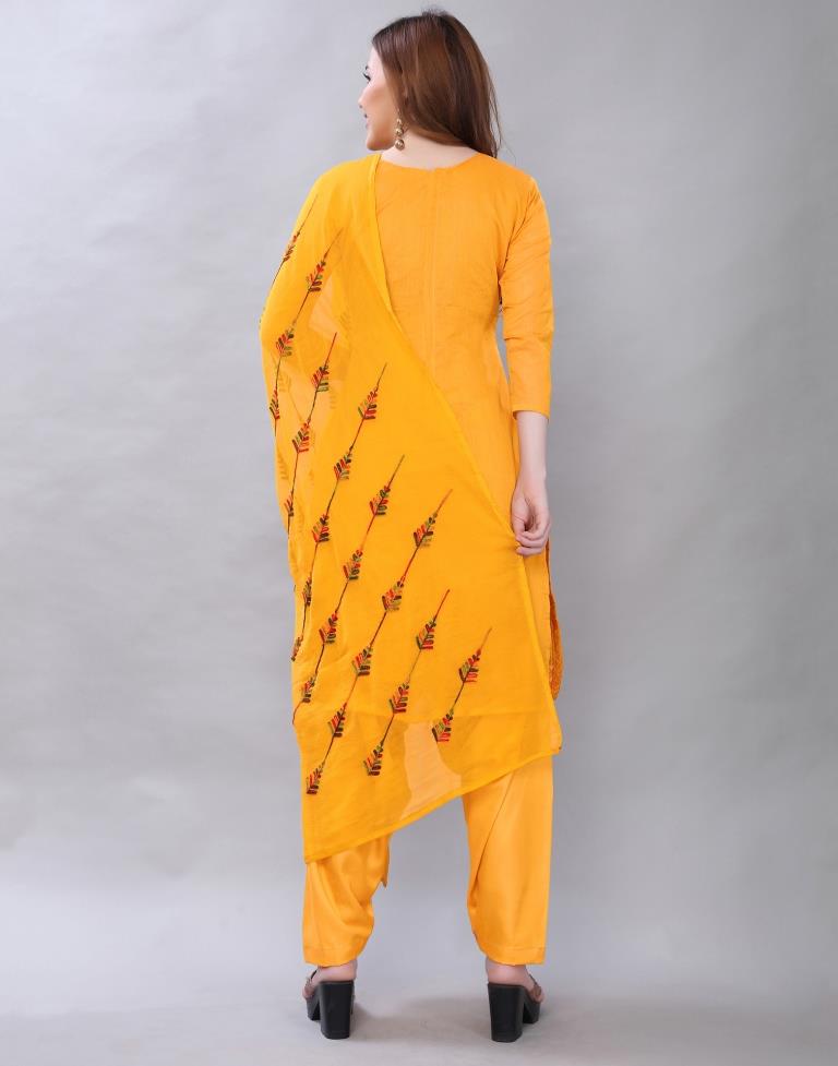 Alluring Turmeric Yellow Cotton Embroidered Unstitched Salwar Suit | Leemboodi