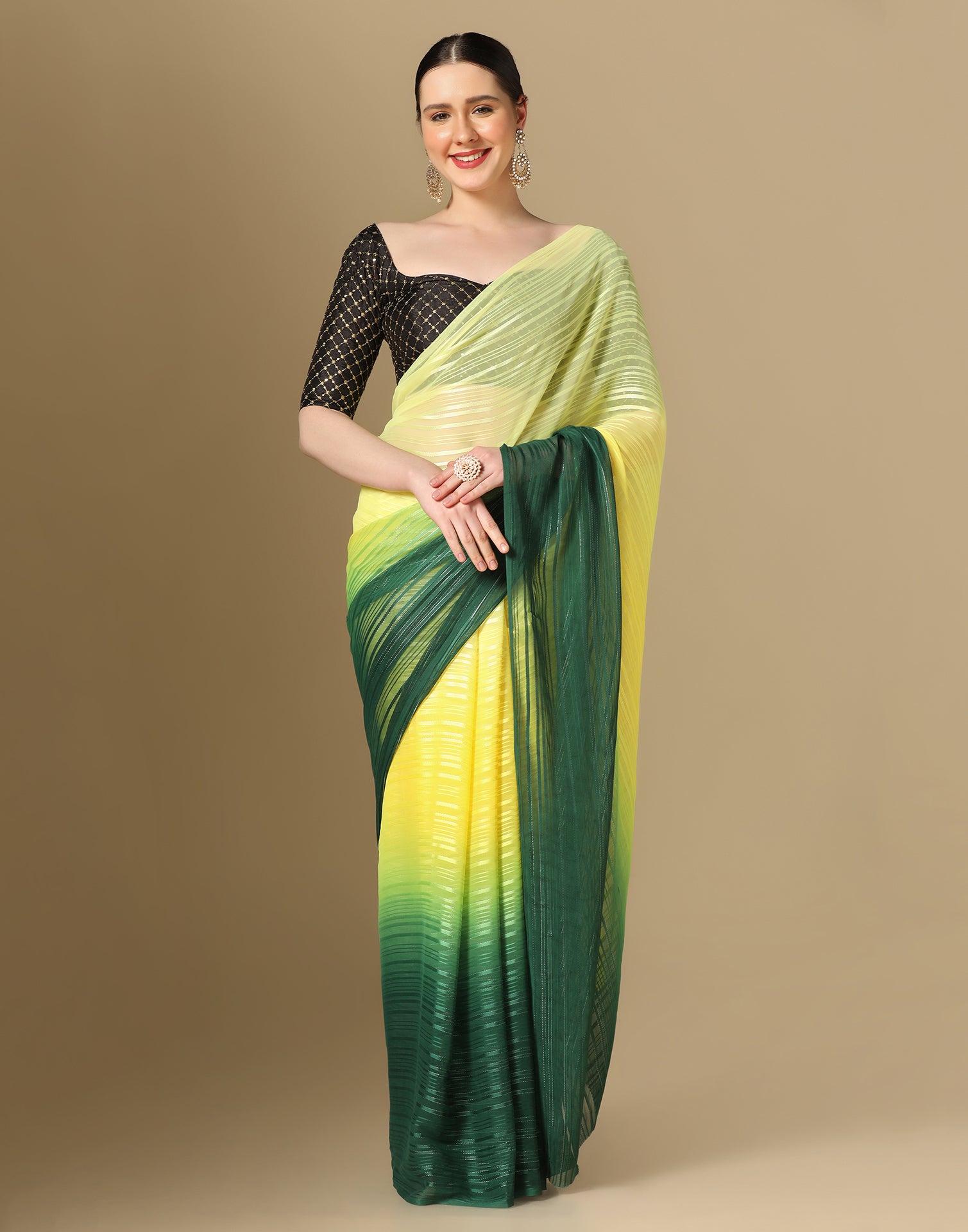 Mustard yellow silk saree with green cutwork embroidery and mirrorwork